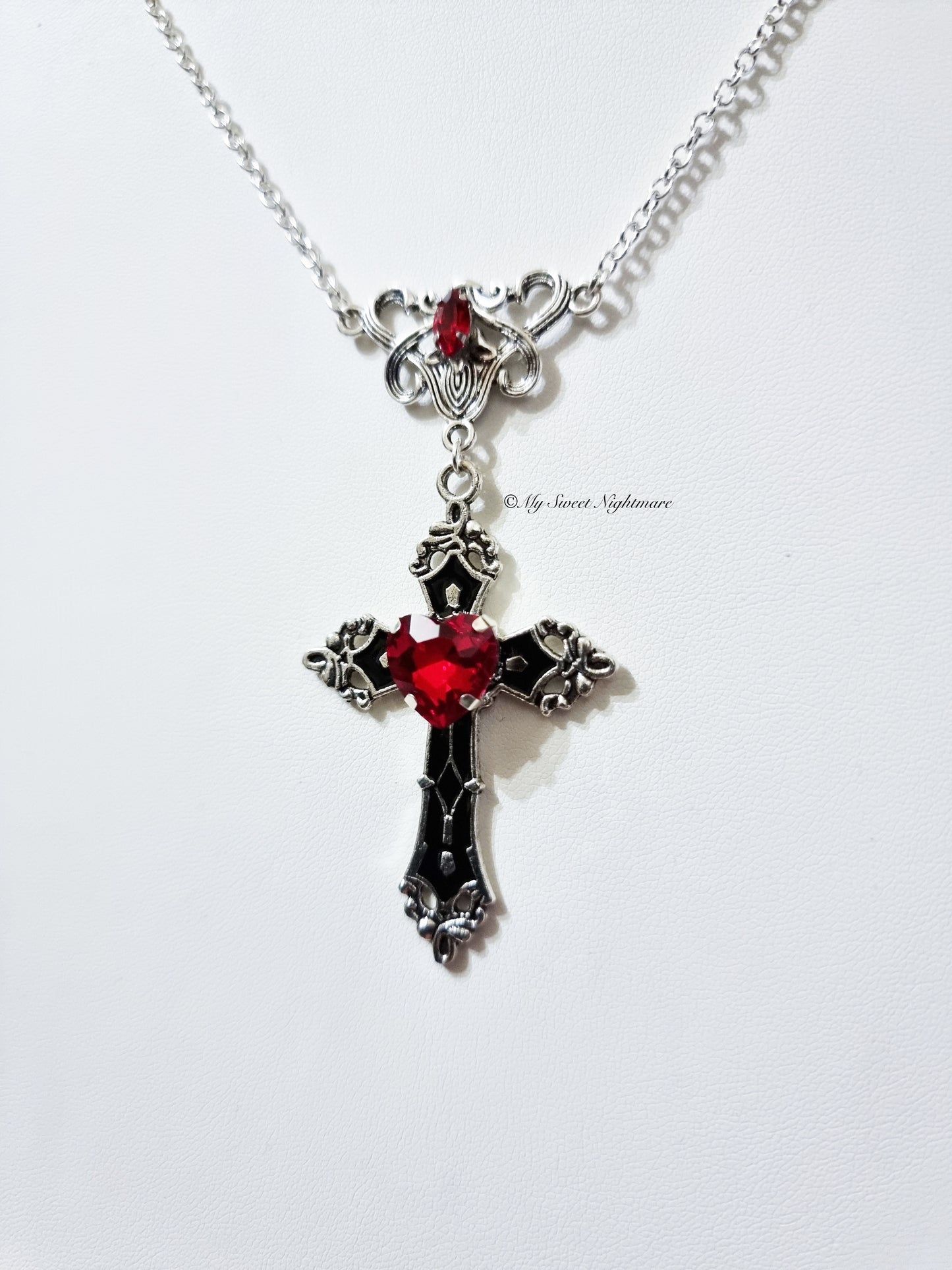 Necklace with black cross and red crystal heart