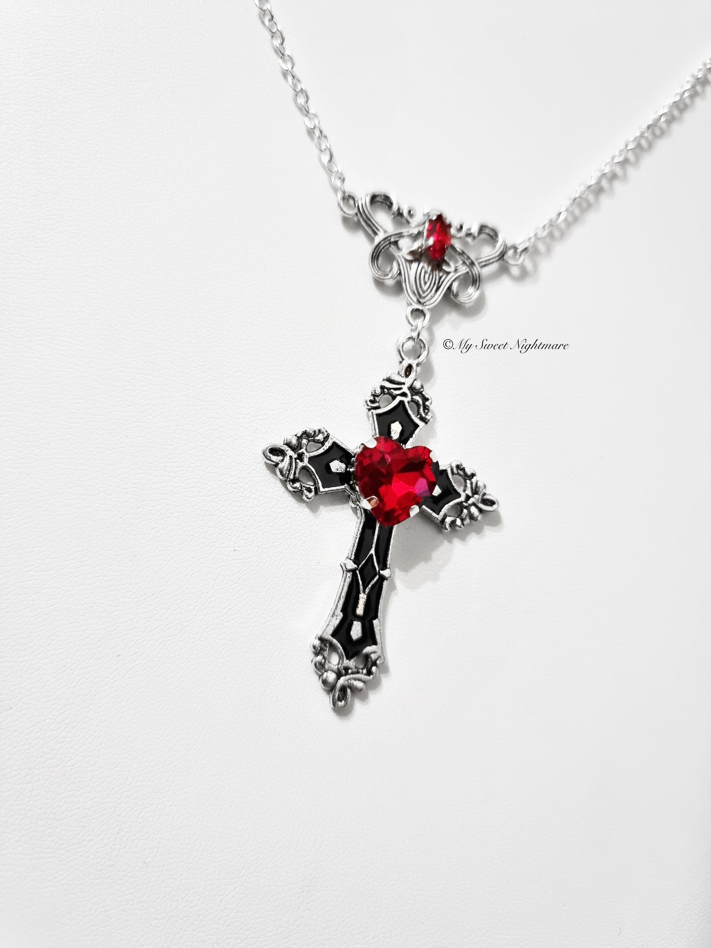 Necklace with black cross and red crystal heart