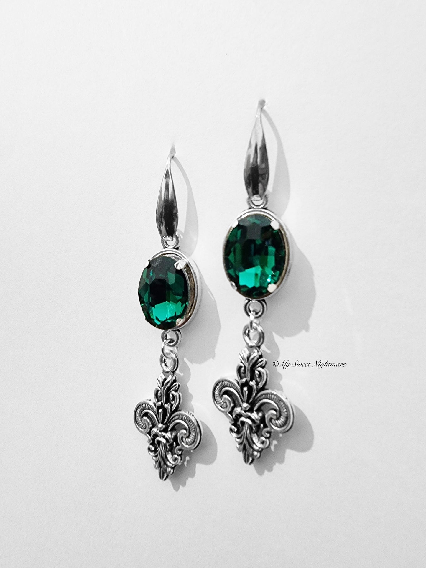 Earrings with lilies and green gems