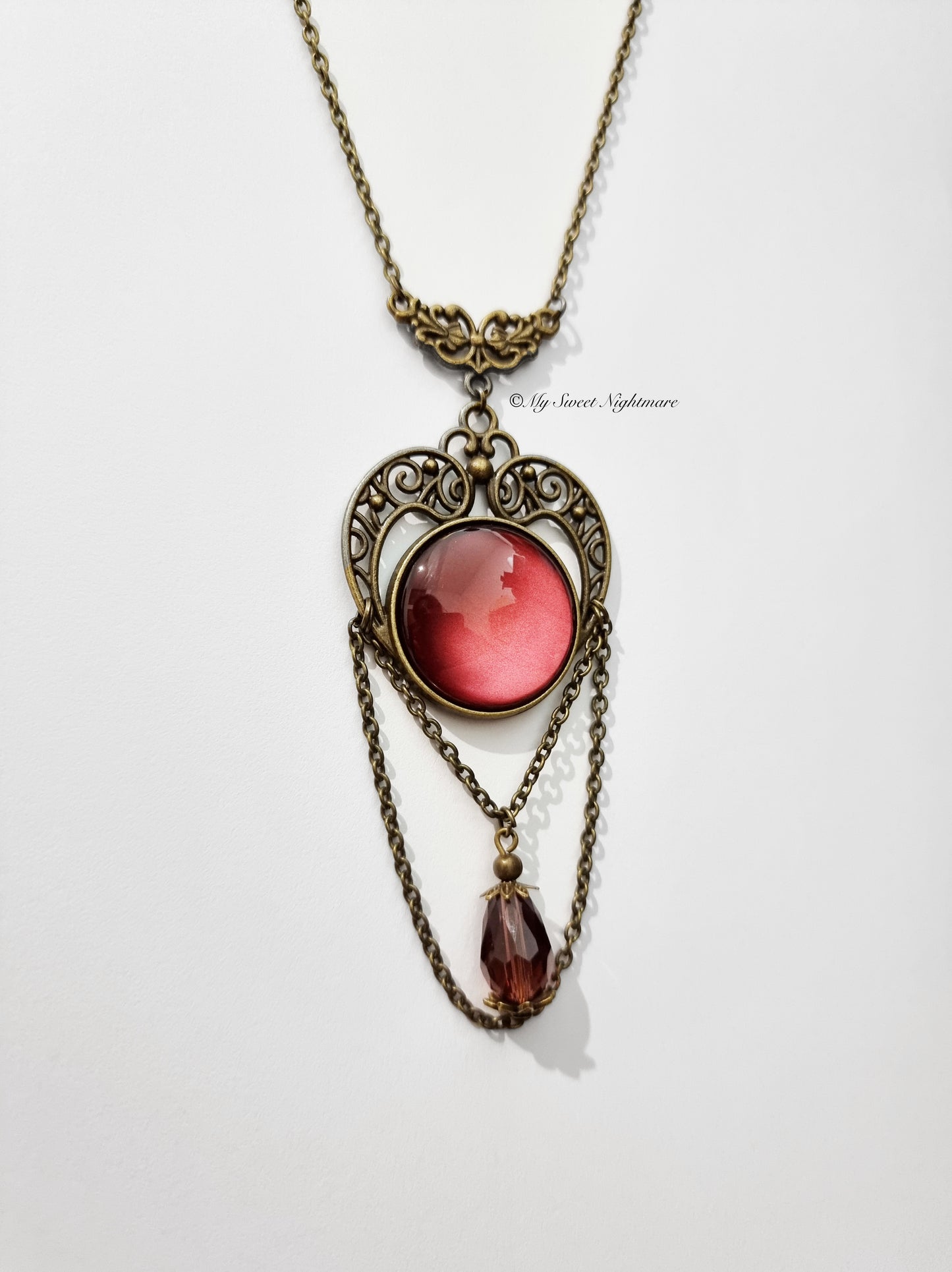 Bronze necklace with red glass and crystal stone