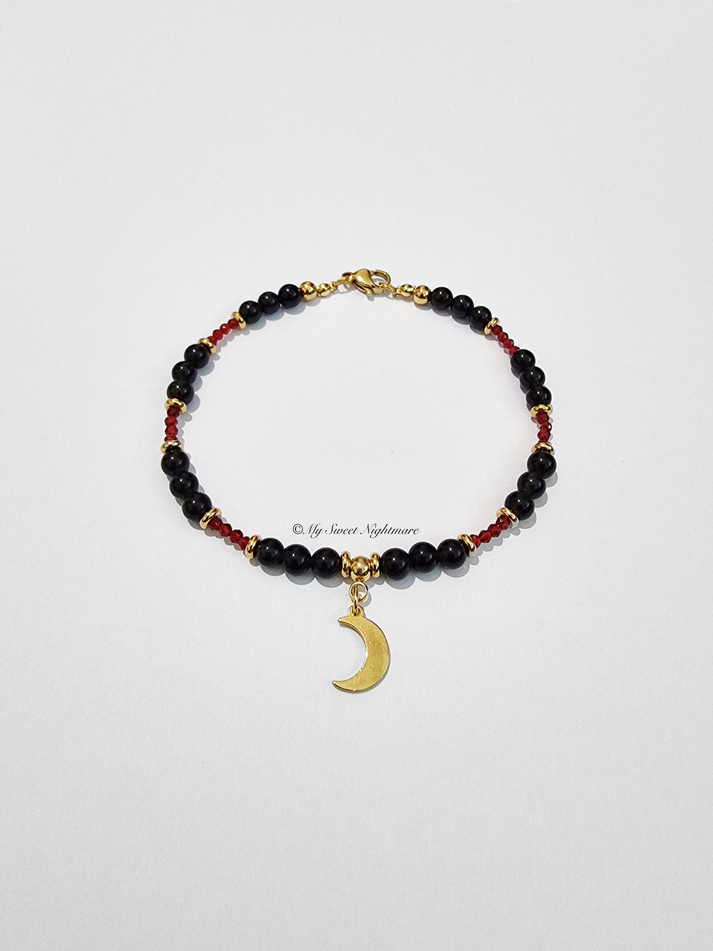 Bracelet with Golden Obsidian, crescent moon and red crystals